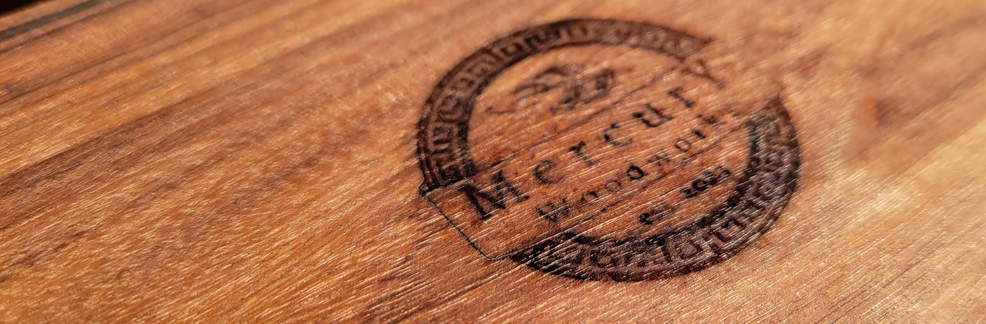 Mercury Woodworks branding on wood